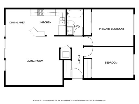 A floor plan of a house with a living room, dining area, kitchen, bathroom, and two bedrooms.